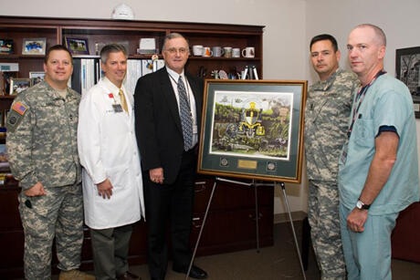 From left: Army Master Sgt. Danny Yakel, program administrator for the Richmond, SOCM program and senior instructor at JSOMTC; Kevin Ward, M.D., associate professor in the Department of Emergency Medicine and VCURES associate director; John Duval, CEO of MCV Hospitals; Army Command Sgt. Maj. Ledford, Stigall of JSOMTC; and Garrett Lewis, a preceptor for the training program.

Photo by Melissa Gordon, VCU Communications and Public Relations