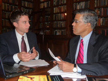 Joe Briere, graduate research assistant, (left) and Dale Jones, Ph.D., associate professor of public administration and director, National Homeland Security Project, prepare for the 51st United States Air Force Academy Assembly.  Not pictured, Austen Givens, project manager of the National Homeland Security Project, who also assisted in the preparations. Photo by Mike Porter, VCU Office of Communications and Public Relations.