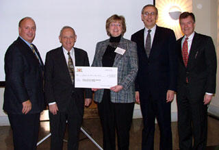 Debbie Weber, vice president and general manager of Philip Morris USA, presents a check for $25,000 to a VCU contingent that includes (from left) board member Stuart Siegel, President Eugene Trani, Rector Edward Bersoff and board member Tom Snead. 

Photo courtesy University Career Center