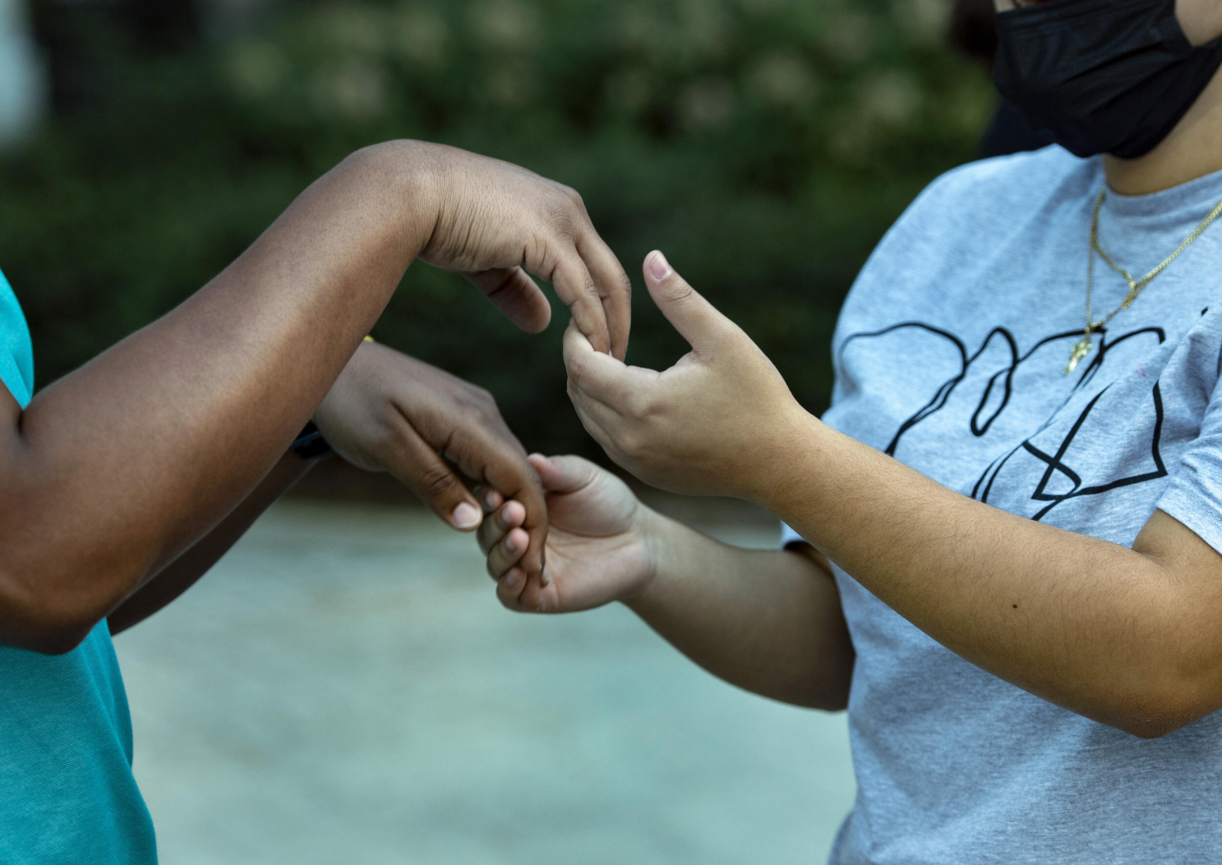 Two sets of hands holding eachother 