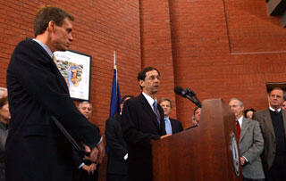 Virginia Gov. Mark R. Warner looks on as Sheldon Retchin, M.D., vice president for Health Sciences at Virginia Commonwealth University and CEO of the VCU Health System, expresses appreciation for proposed funding to promote research and development.

Photo courtesy Creative Services