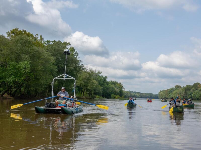 VCU students paddle alongside a Terrain360 boat that generated a panoramic virtual tour of an 11-mile stretch of the Middle James River studied by the students. (Photo courtesy of James Vonesh)