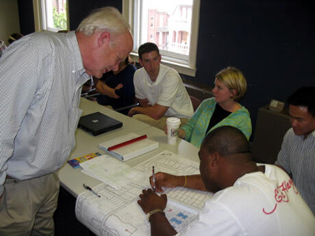 Students in VCU’s urban and regional planning program create dozens of community plans in the Richmond area each year.  Here, instructor Ralph Higgins and members of his summer site planning class pore over documents in preparation for their presentation to administrators of Union Theological Seminary. The class created three scenarios to help the seminary determine the best use of property it owns in North Richmond. Photo by Mike Porter, VCU Office of Communications and Public Relations.   