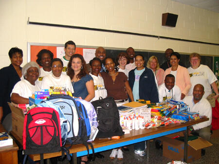 Faculty and staff of Martin Luther King, Jr., Middle School and members of the VCU Staff Senate proudly stand behind a table of some of the school supplies collected during VCU’s Back to School Drive.

Photo by Malorie Janis, University News Services