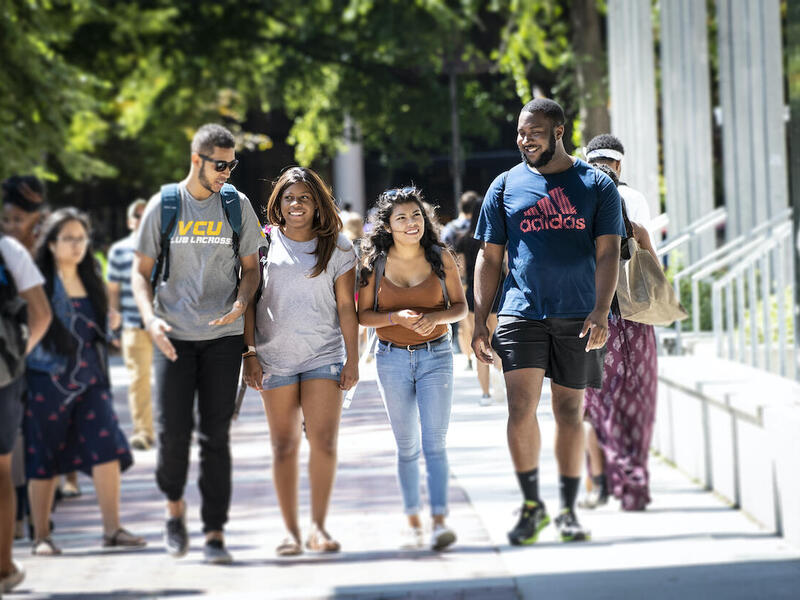 VCU students walk through the Monroe Park Campus on the first day of classes in August 2018. A new study by researchers identifies factors that drive student drop-out rates. Among them: Involvement in student organizations, living on campus and greater social support are associated with a lower likelihood of dropping out of college. (Allen Jones, University Marketing)