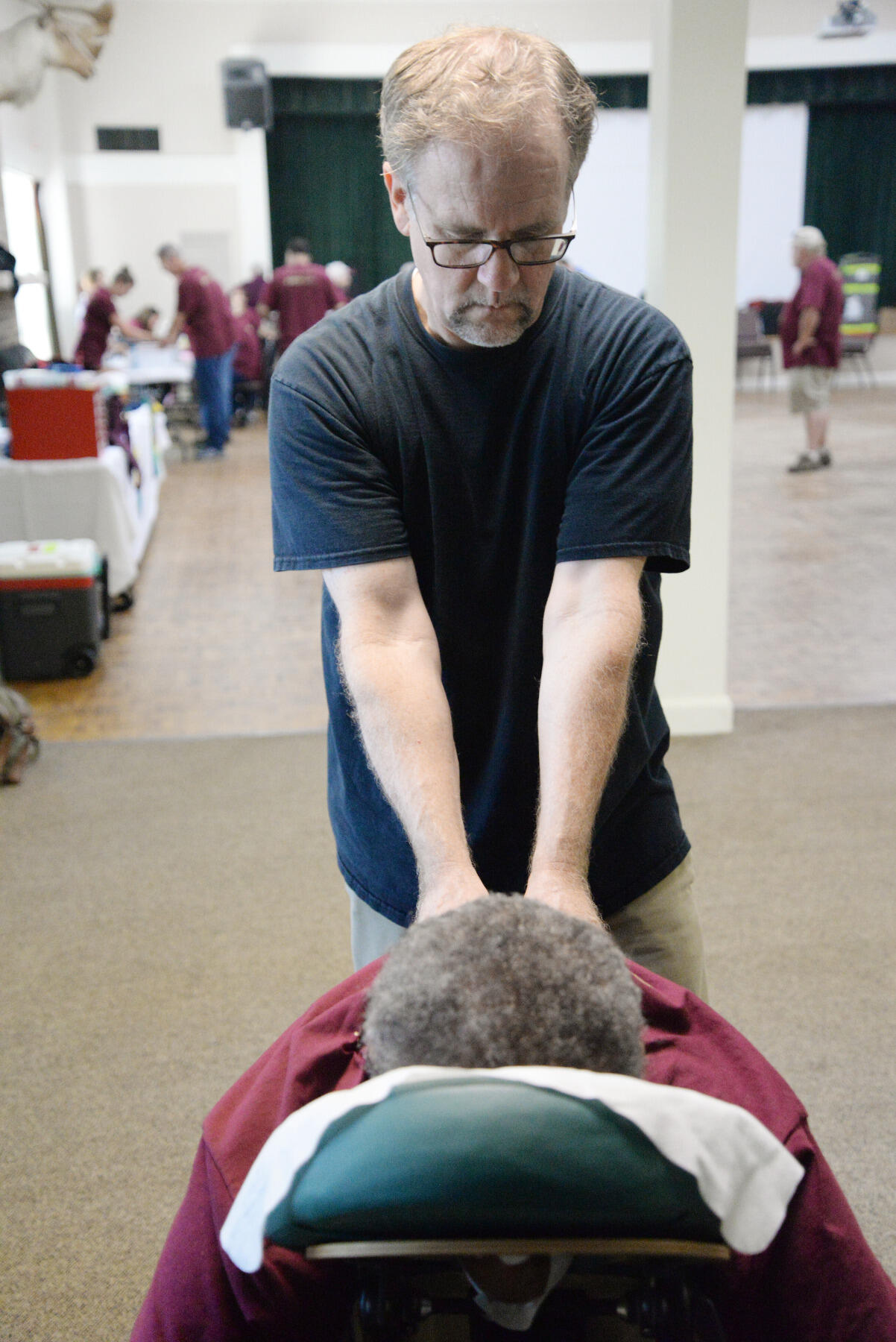 James Arbuckle of Nimbus Massage gives a massage to a participant at the Retreat and Refresh Stroke Camp sponsored by VCU Health.
