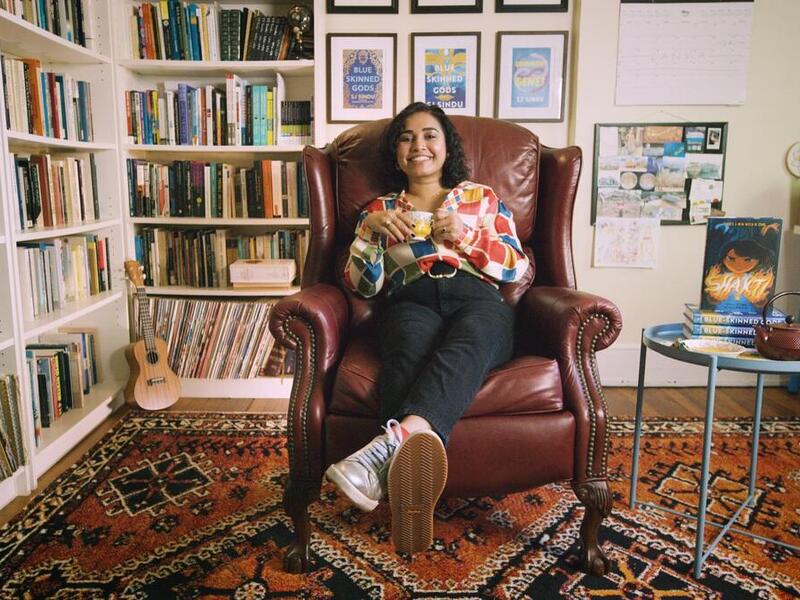 SJ Sindu, Ph.D., an assistant professor in the Department of English at VCU’s College of Humanities and Sciences, teaches creative writing and released her first graphic novel, “Shakti,” this week. Here, she enjoys a cup of tea in her home office. (Max Schlickenmeyer, Enterprise Marketing and Communications)
