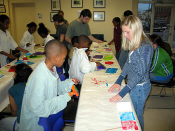 VCU student Amber Efford guides Carver-VCU After-School Arts student Ke’Jsean Roberts in printmaking. Both participated in a pilot program in the fall of 2006. Photo by: Nancy Lampert, Ed. D., assistant professor, department of art education.