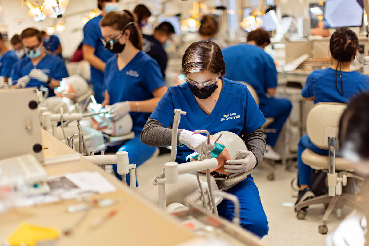 A photo of dental students working on patients 
