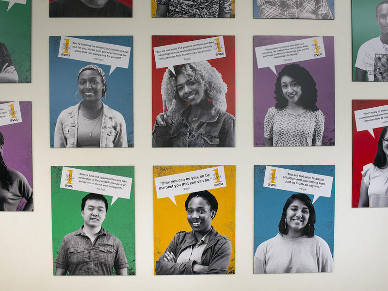 art exhibit of portraits of first-generation college students on a wall