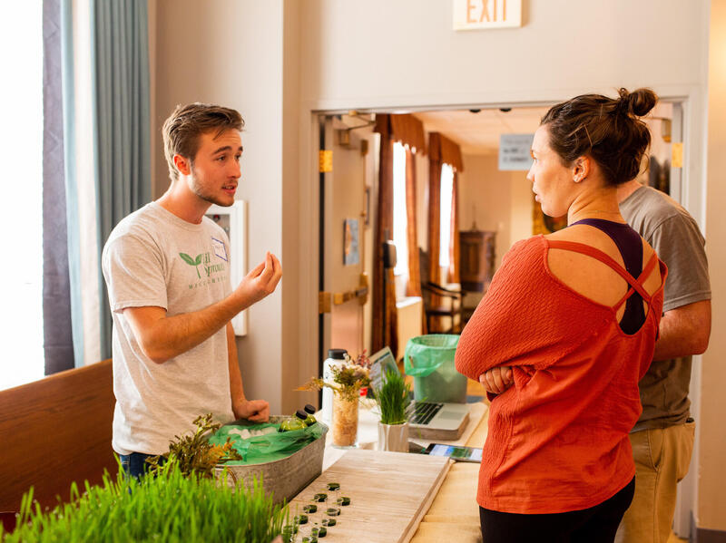 Lil' Sprouts Microgreens founder and VCU student Trenton Jackson demonstrating his product at a past Real Local RVA event. (Photo courtesy of Trenton Jackson)