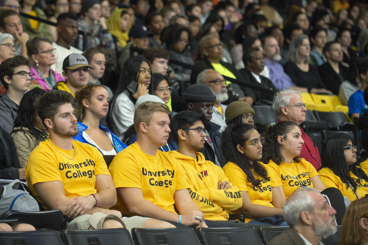 Audience members listening to a lecture at the V C U Siegel Center.
