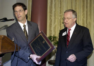 Sheldon Retchin, M.D., CEO, VCU Health System and VCU vice president for Health Sciences, presents Del. Kenneth Plum, D-Fairfax with a plaque during the Virginia Commonwealth University’s Virginia Center on Aging Legislative Breakfast.   Photo courtesy Virginia Center on Aging