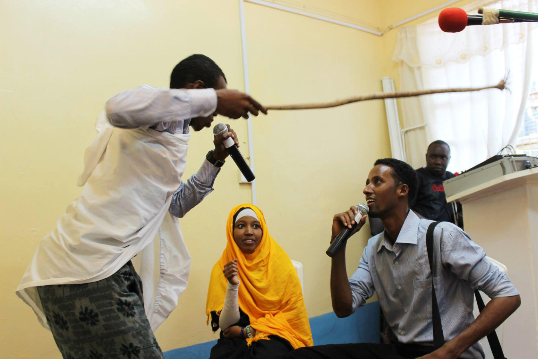 Youth leaders and staffers of the mental health clinic in Nairobi perform a play about substance abuse and domestic violence.
<br>Photo by Hyojin Im.
