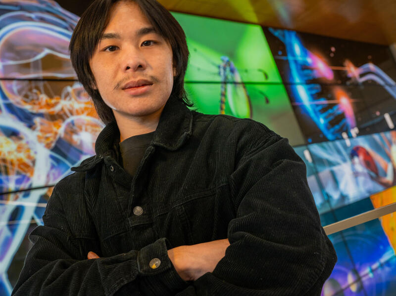 A photo of a man with his arms crossed against his chest.