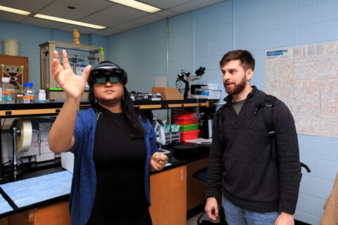 Students in Wijesinghe's lab interface with the Microsoft HoloLens AR platform. 

