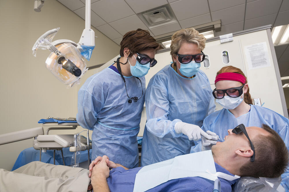 Future dental hygienists learn to use a diode laser to reduce bacteria prior to scaling and root planing procedures. (Photo courtesy VCU School of Dentistry)
