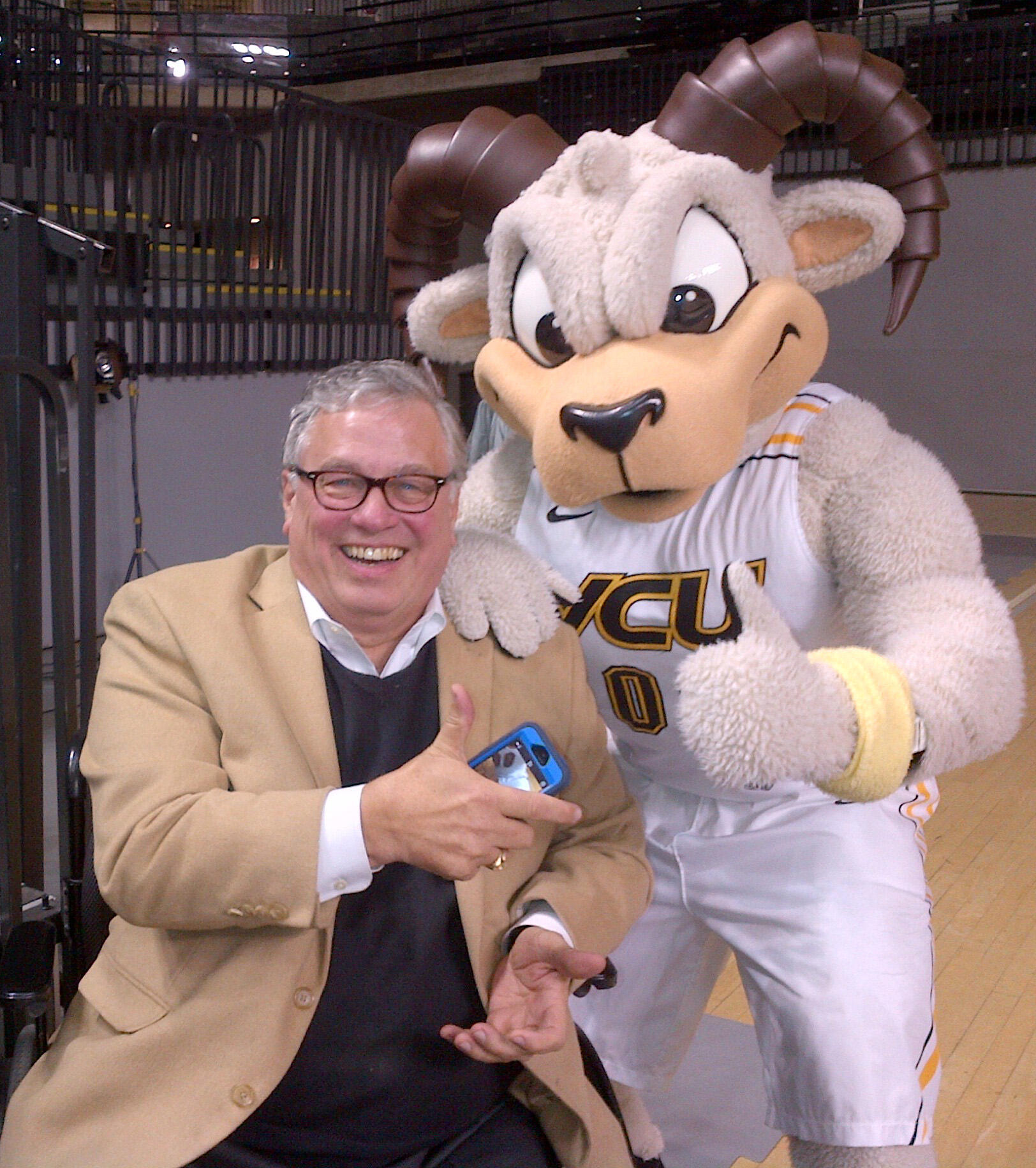 Jim Rothrock with Rodney the Ram at a VCU basketball game. 