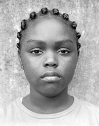 U'maana, a student at Carver Elementary School, is featured in Wendy Ewald's photographic banner exhibit, Carver Portraits.

Photo Courtesy of the Hand Workshop Art Center