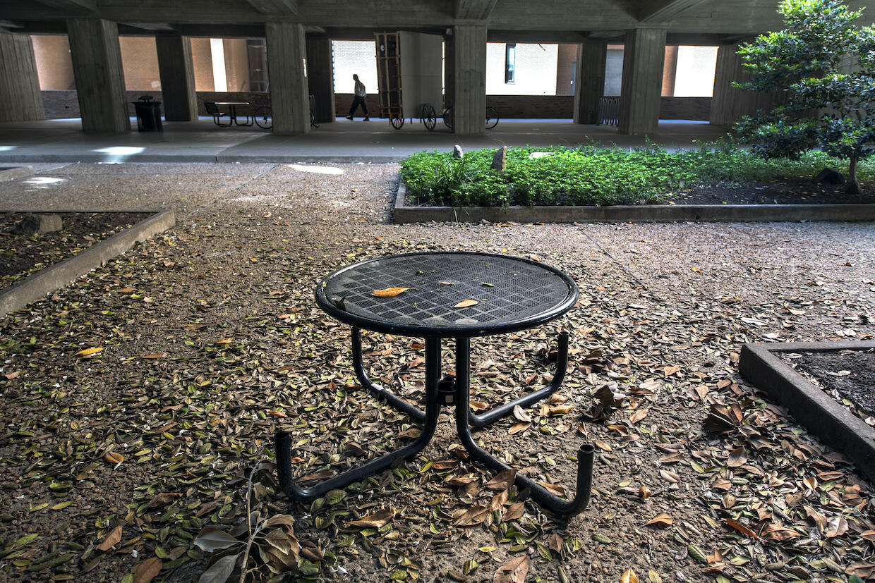 a metal table inside the pollak building courtyard at vcu