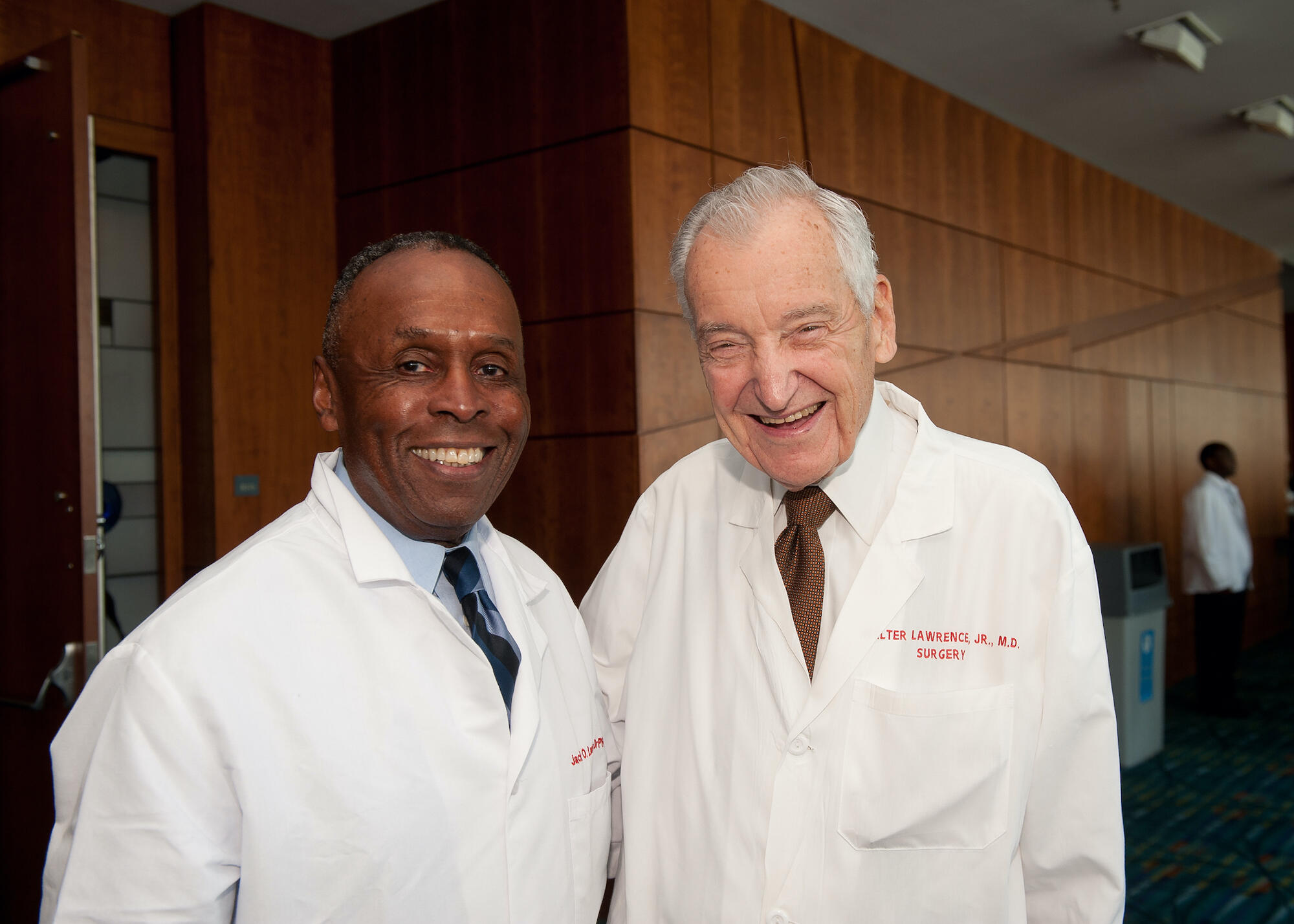 Two doctors standing in white coats 