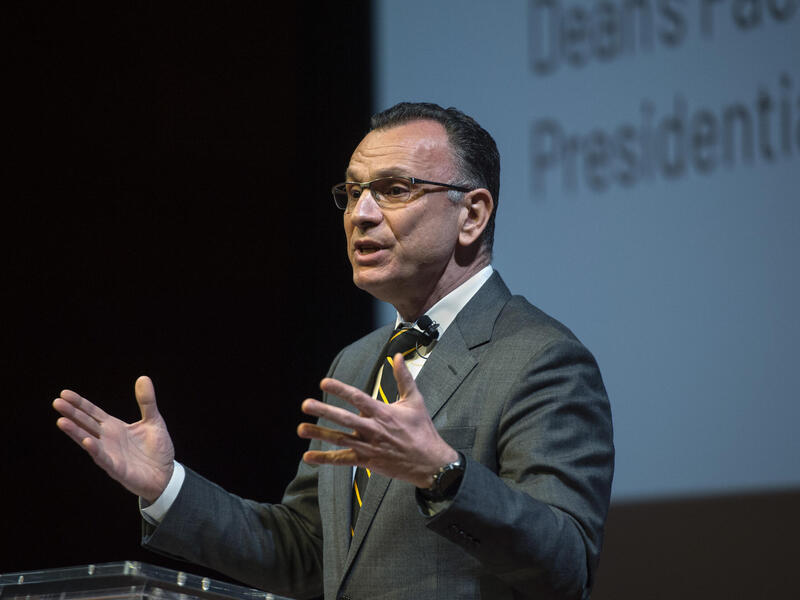 Fotis Sotiropoulos, Ph.D., provost and senior vice president for academic affairs at VCU, delivering the university’s inaugural State of Academic Affairs Address wearing a grey suit and looking to the left