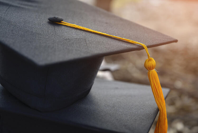 Graduation cap and tassel. 