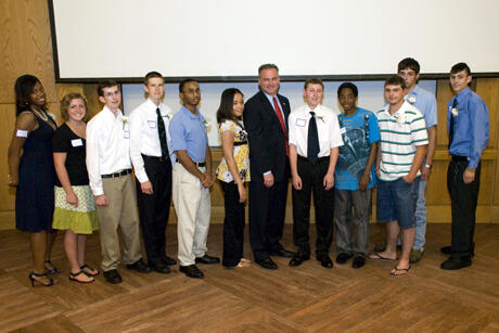 The Class of 2009 stands proud with Virginia Gov. Timothy Kaine at the graduation celebration in honor of those students who have managed their academic responsibilities while undergoing treatment for cancer or sickle cell disease. Photo by Melissa Gordon, VCU Communications and Public Relations.
