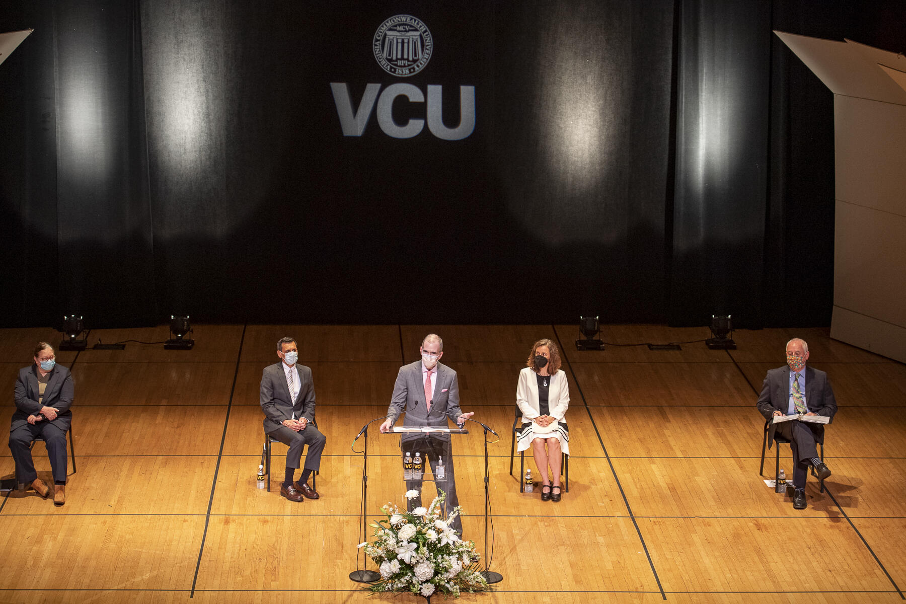 An overhead photo of Ray Shepherd speaking at the podium during VCU's annual Faculty Convocation event. 