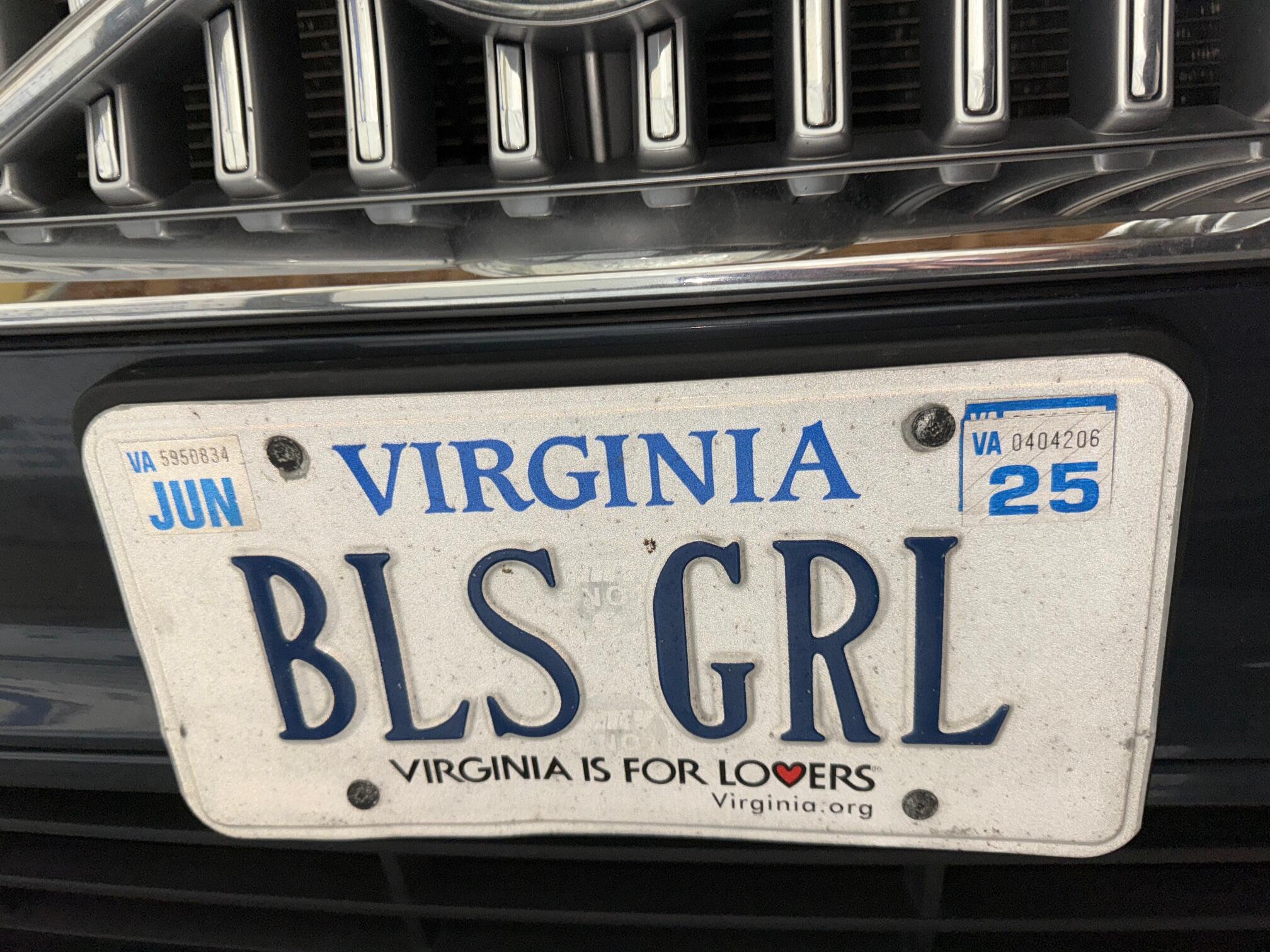 A photo of a Virginia liscence plate that says \"BLS GIRL.\" 