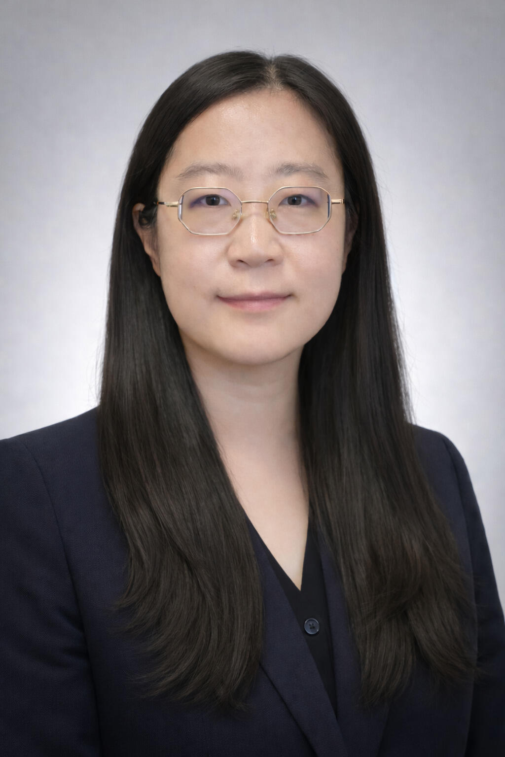 A photo of a woman from the chest up. 