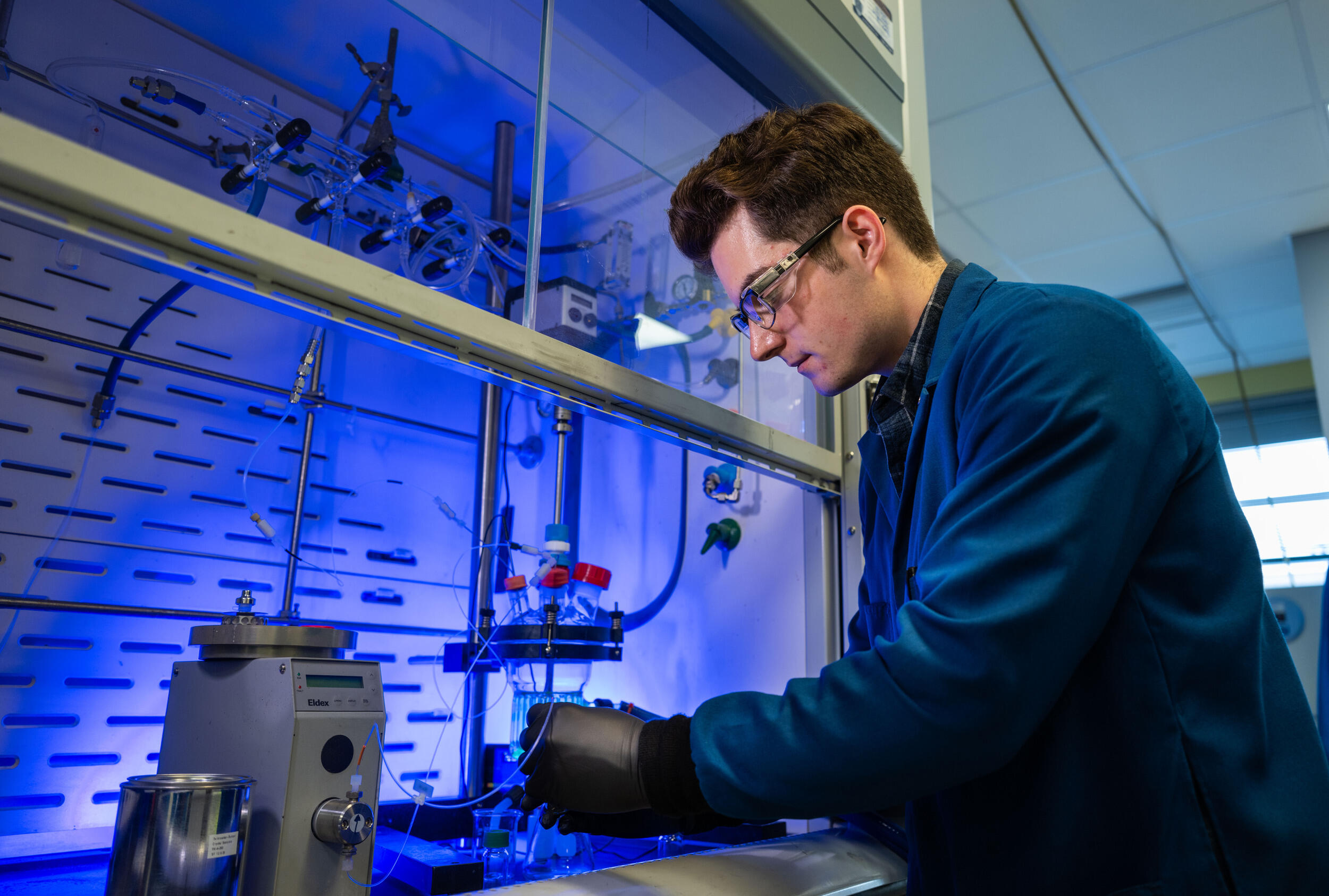 A photo of a man in a research lab. 