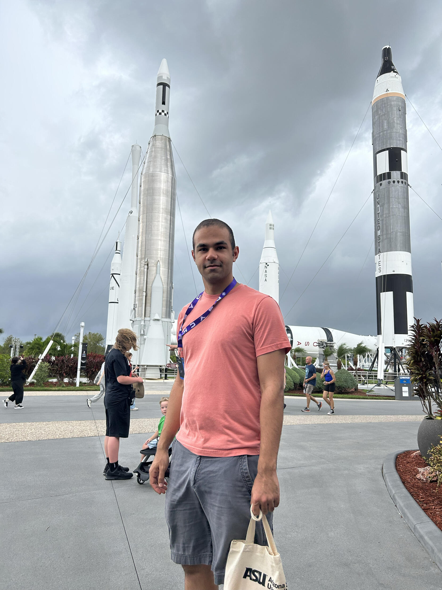 A man standing in front of rockets