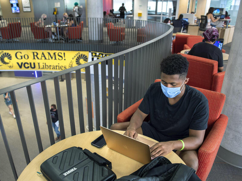 Maher Mubarak studying in Cabell Library