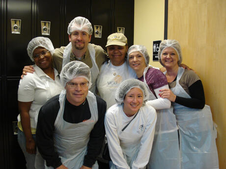School of Social Work volunteers prepared and served meals on April 14 at the Central Virginia Foodbank. Front row: Daniel Park, budget analyst; Candice Tam, office manager. Back row: MeMe Thornton., M.S.W. program support; Ananda Newmark, M.S.W., retention and recruitment coordinator; Gwenevere Taylor, M.S.W. program administrative assistant; Pamela Duffus, dean’s assistant; and Lisa Pond, personnel director. Photo by Kathleen Kassen/Central Virginia Foodbank.