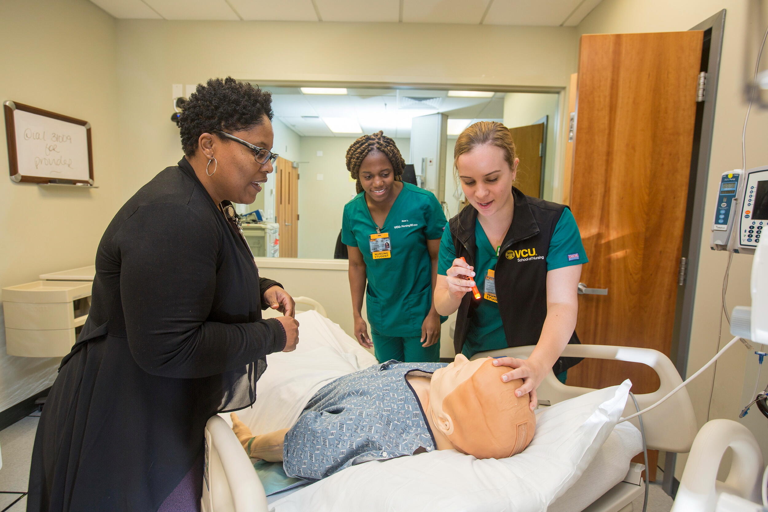 Students work in a simulation lab at VCU School of Nursing.