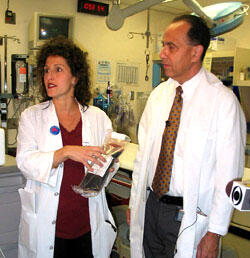 Dr. Therese Duane (left) and Dr. Joe Ornato discuss the blood substitute PolyHeme during a VCU Medical Center press briefing. PolyHeme looks like blood and is designed to carry oxygen to organs and tissues the way blood does.

Photo by Joe Kuttenkuler, University News Services