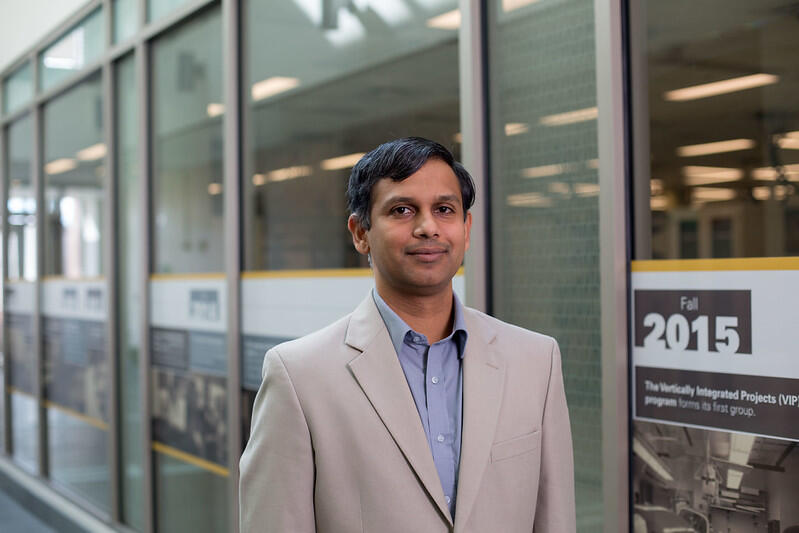 A photo of a man from the chest up. 
