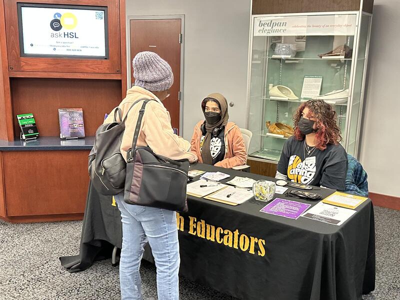 Peer health educators Mishal Hussain and Sabereh Saleh at the Health Sciences Library talking about health and well-being issues associated with sleep. (Photo credit: RecWell.)
