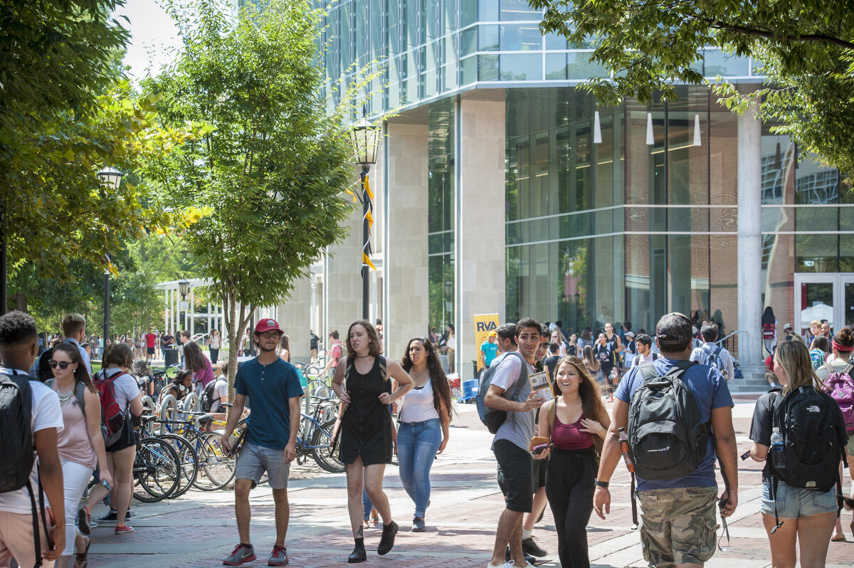 Students walk across the Compass on the way to class.