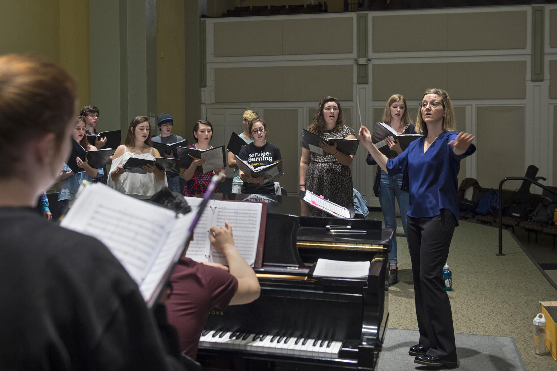 Erin Freeman, who holds a joint position as director of the Richmond Symphony Chorus and Director of Choral Activities at VCU, leads the VCU Commonwealth Singers during a rehearsal of “Open Minds, Closer Thoughts."