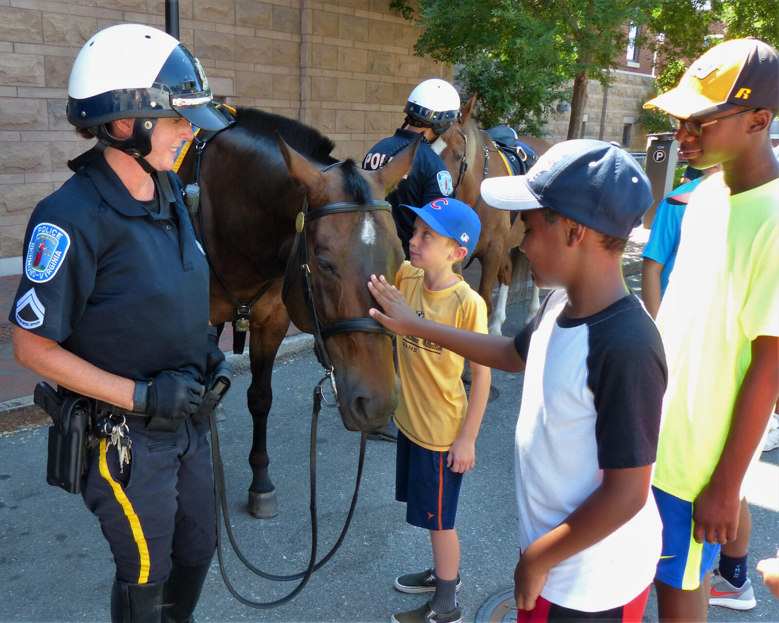 Richmond Police introduced multiple mounted units to campers and counselors from the Mary and Frances Youth Center and the Police Athletic League.