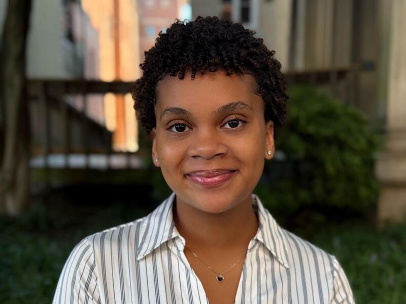 A photo of a woman from the shoulders up. 