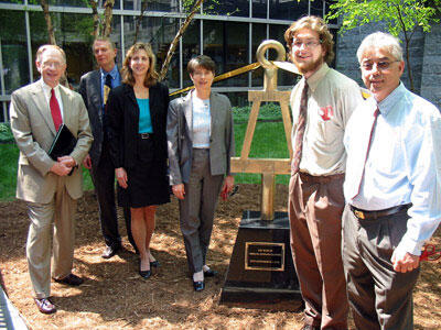 Posing with a sculpture of the national engineering honor society's logo, "The Bent," from left: Robert J. Mattauch, VCU School of Engineering dean; Bill Lampe, Engineers Plus principal; Linda Allen-Hawkins, Philip Morris USA director of cigarette manufacturing projects and technology; Elizabeth Fessenden, VCU School of Engineering trustee and president of Alcoa Flexible Packaging; Jacob H. Leach, engineering student and president of the Virginia Epsilon chapter of Tau Beta Pi, and Frank Ameri, Engineers Plus principal.

Photo by Mike Frontiero, University News Services