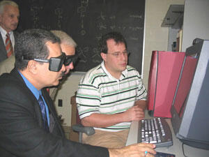 Victor Yanchick (top left) looks on as Mustafa Al-Hiti (left) and Kenneth Miller wear 3-D goggles to view a 3-D drug molecule displayed on a computer and described by VCU postgraduate student Philip Mosier, Ph.D.

Photos by Michael Ford, University News Services