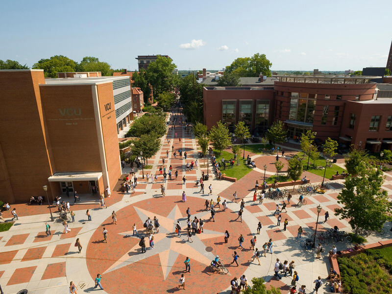 Aerial view of the Compass area on VCU's Monroe Park campus, an open common area filled with people.