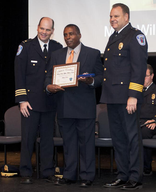 Officer William Turner (middle) stands with members of the Richmond Police Department to accept the Medal of Valor award at the Richmond Police Department’s Salute to Excellence Award Ceremony. 