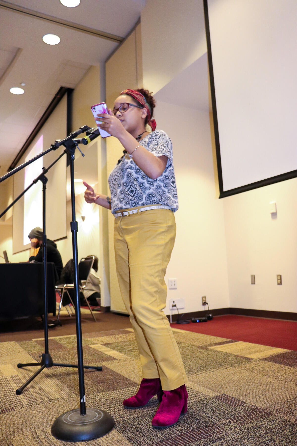 A student performs spoken word poetry at the MLK Cafe and Design event. Photo by Deaudrea Rich.