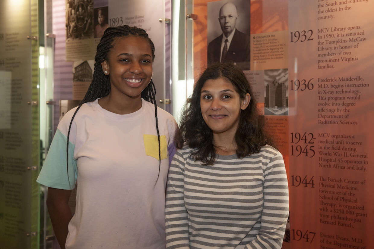 Kaya Smith and Anna Kovilakath standing in the student lounge on the MCV Campus.