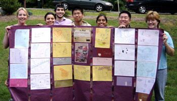 Anita M. Navarro, left, and her Project HEART group display a paper quilt Navarro made out of artwork the group created during its first year. Kevin Lee is second from the right. 

Photos courtesy Kevin Lee
